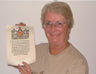 Pauline Wainwright with the Commemoration Scroll of her great uncle, Private Stanley Garnar