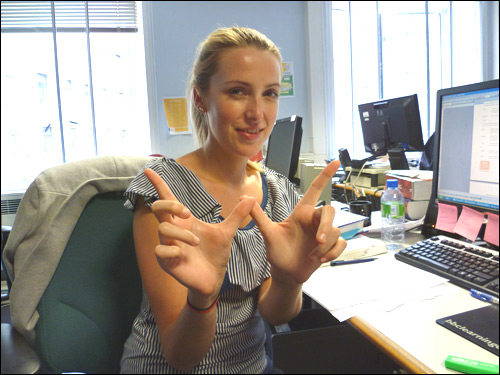 LE's Natalie does the whatever symbol