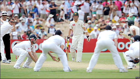 Graeme Swann bowls to Mike Hussey