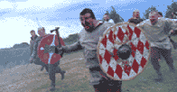 Image of Celtic warriors running into battle holdings shields and swords