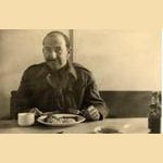 My dad having lunch before tackling office work for stores delivery in Kiel 1944.