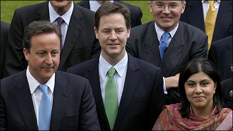 Baroness Warsi (right) with Prime Minister David Cameron (left) and Deputy Prime Minister Nick Clegg (centre)