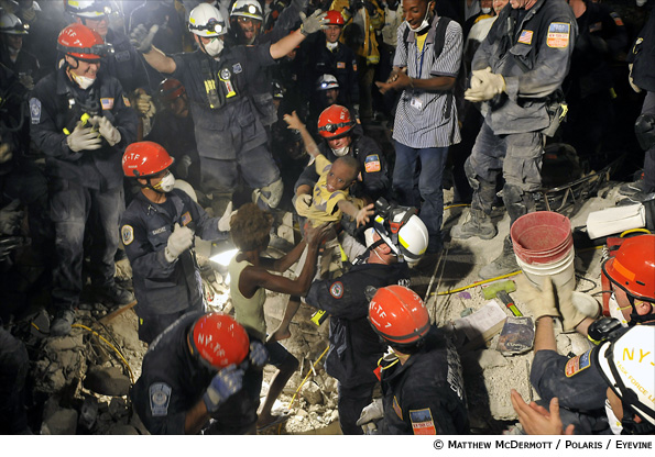 Mathew McDermott's photograph of Kiki being lifted from the rubble