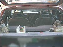 Puppets in the back of the car