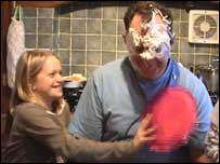 Man being hit in the face with a pie