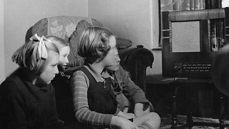 Children listing to the radio