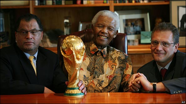 Danny Jordaan, Nelson Mandela and Jerome Valcke with the World Cup