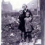 Barbara with her mother and sister in their garden, the morning after the bombing.