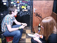 Woman interviewing band member