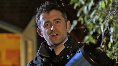 Mark Thompson posing with a telescope