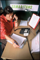 A Samaritan counsellor taking a call from someone in distress.