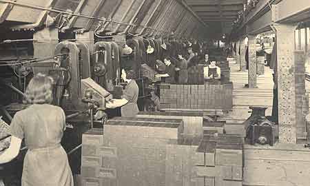 Women working the presses, 1940s
