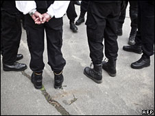 Members of the Hungarian National Guard wait for a Jobbik meeting in Budapest, 7 April 2010