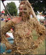 Girl covered in straw