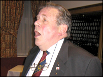 Keith Malpass sings the school song