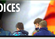 Image of Catholic schoolboys, backdrop Irish flag