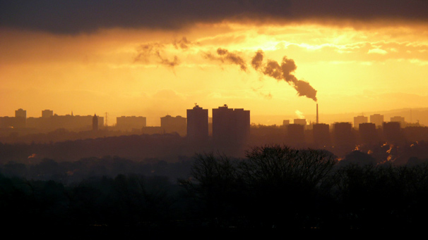 Dawn view of Glasgow with chimneys and tower blocks