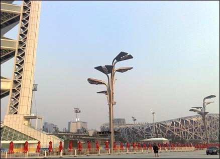 The Ling Long pagoda (left) and Birds Newst stadium (right). My colleages Matt and Tom are the two small dots in the foreground