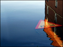 Flood sign under water