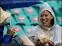 Cricket fan during an Australia-NZ match in the December rain