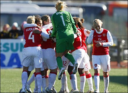 Emma Byrne jumps to join the other Arsenal players after Alex Scott scores in the last minute of the final match of the Women's Cup against Umea IK