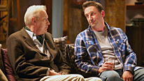 Lee (Lee Mack, right) is banished to the sofa by his dad (Geoffrey Whitehead)
