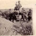 George Brown under the drawn arrow facing front. This is the gun team from El Alamein but the gun and some team members are the same.