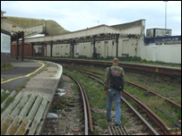 Evan wanders in a disused train station