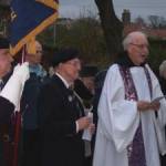 14.11.2004 St Begh’s RC Church, Whitehaven Cumbria. (Left to right): George Dunn (Standard Bearer), Billy Pye, Dom Luke Wareing OSB. On the afternoon of Remembrance Sunday 2004, a short ceremony was held at St Begh’s to remember the victims of the World Wars. [Photograph by Joseph Ritson]