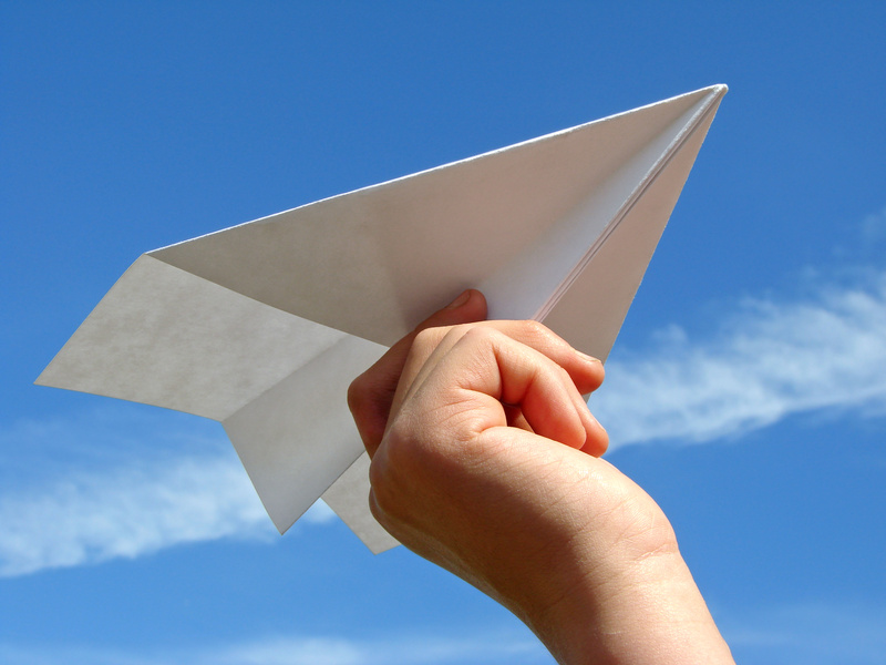 child's hand with paper plane @ D Leonis - fotolia