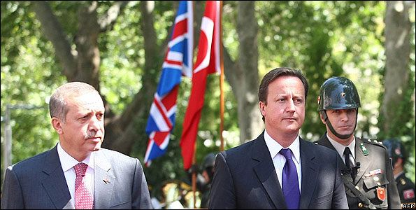 UK Prime Minister David Cameron (centre) inspects honour guard with Turkish Prime Minister Recep Tayyip Erdogan, 27 Jul 10