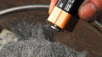 Battery terminals brushed against steel wool