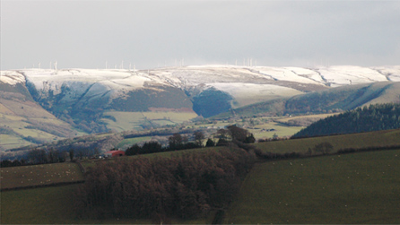 Snow on the wind farm above Llandinam by Bill Pugh, Y-Fan.