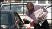 Trevor Ncube selling newspapers to motorists in Harare, Zimbabwe, October 2001. Photo: AFP/Getty Images 