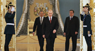 Russian President Vladimir Putin, center, followed by Foreign Minister Sergey Lavrov, left, and Putin foreign policy aide Sergei Prikhodko
