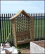 The arbour against the fence