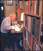 Man writing at desk