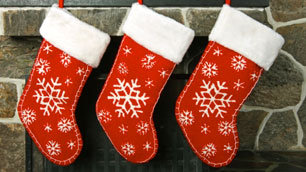 Christmas stockings hung over a fireplace