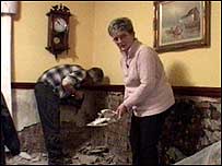 Couple clearing up house 