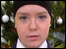 Schoolgirl in front of christmas tree