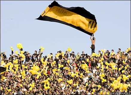 Penarol fans attend their team's match against Nacional