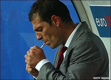 Bilic lights a cigarette
