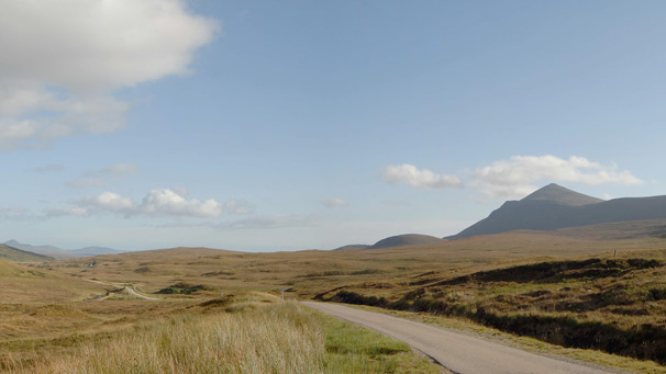Single track road disappears to far horizon