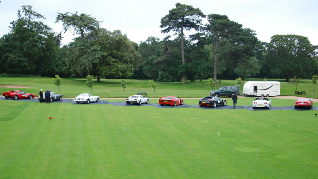 The Magnificent Seven Cars lined up on the lawn