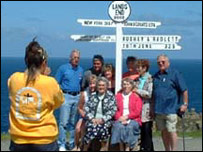 People having photo taken at famous Lands End 