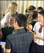 Dom signs some autographs