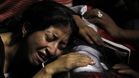 Egyptian Christian mourns (Reuters)