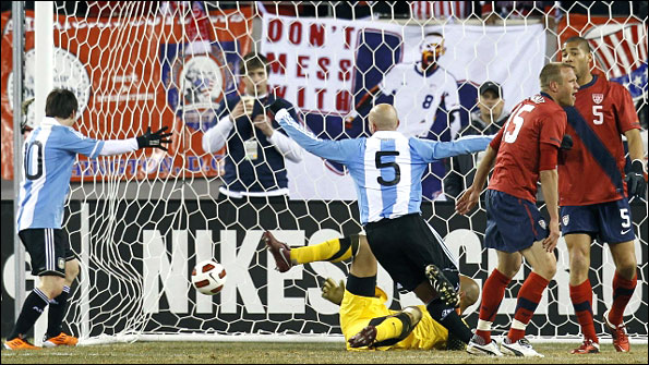 Argentina's Esteban Cambiasso celebrates his goal with team-mate Lionel Messi 