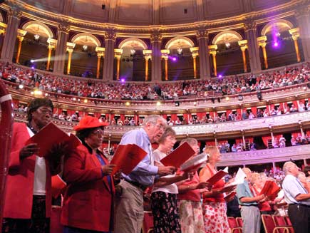 Audience members on their feet to join in a hymn