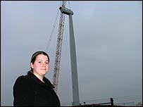 Victoria Cockrell in front of the wind turbine